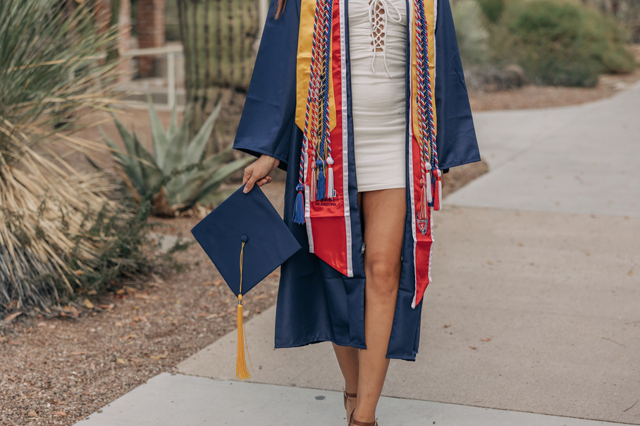 Woman in Graduation Stole, Robe and Cap at Campus Grounds